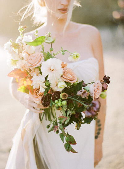 Bride holding floral display for Long Island Wedding