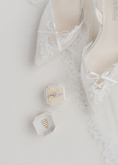 Bride hands by lace gown for Colorado wedding