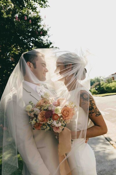 bride and groom looking at each other