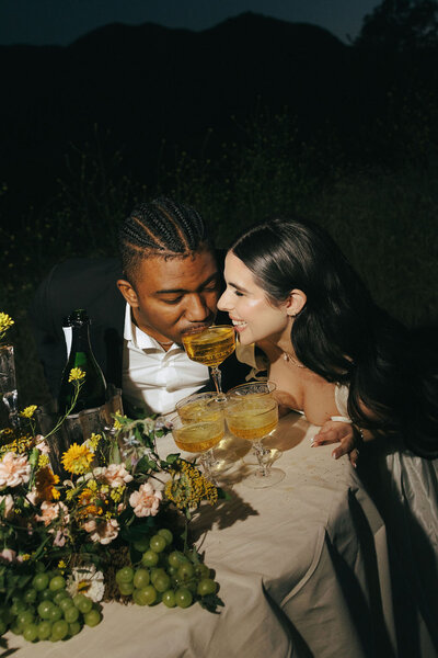 editorial image of bride and groom and champagne tower in Malibu, CA captured by Los Angeles wedding photographer
