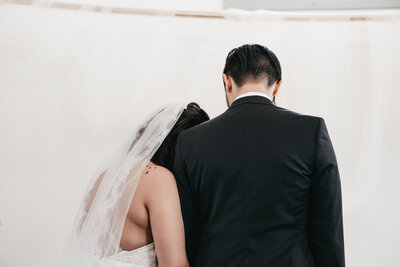 Couple saying a prayer during their intimate wedding ceremony.