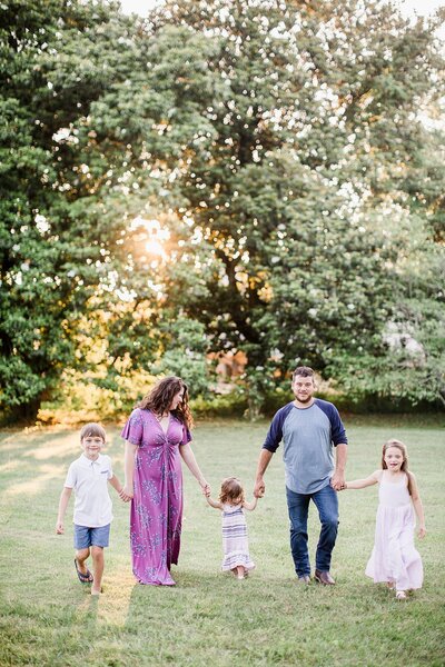 family holding hands by Knoxville Wedding Photographer, Amanda May Photos