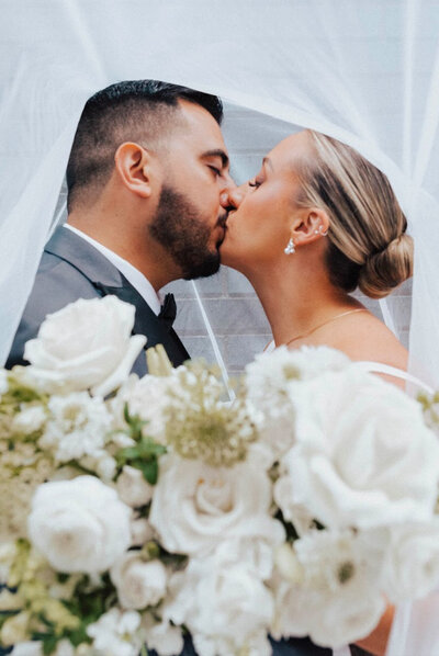 Bride and groom kissing