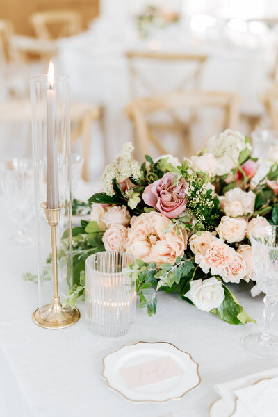 Close up of wedding florals with bridal hairpiece