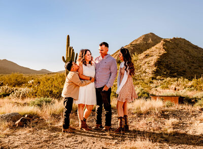 family smiling together in Arizona desert by Cactus & Pine Photography LLC