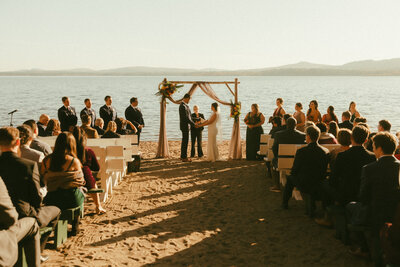 Wedding ceremony along the shore of a lake