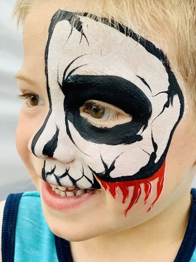 book with skeleton face paint
