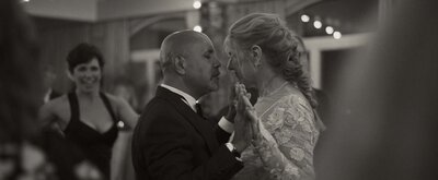 Bride and groom holding hands
