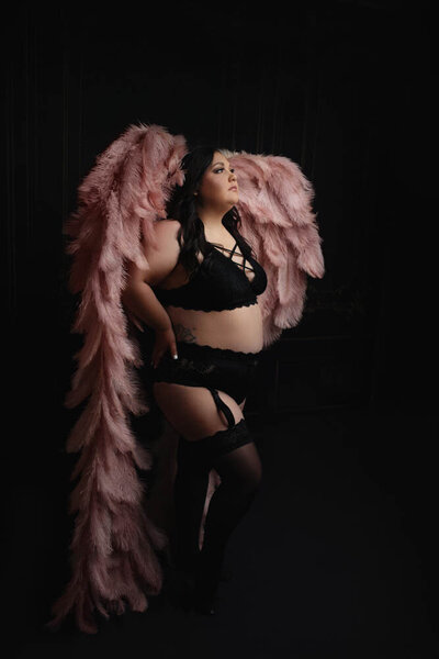woman posing by window for rhode island boudoir photographer kerry callahan boudoir