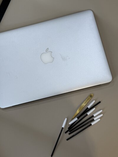 Sunlit neutral-toned therapy space with a cozy couch and candle, symbolizing safety, calm, and nervous system regulation in trauma therapy with Jessie Withers, Los Angeles, CA