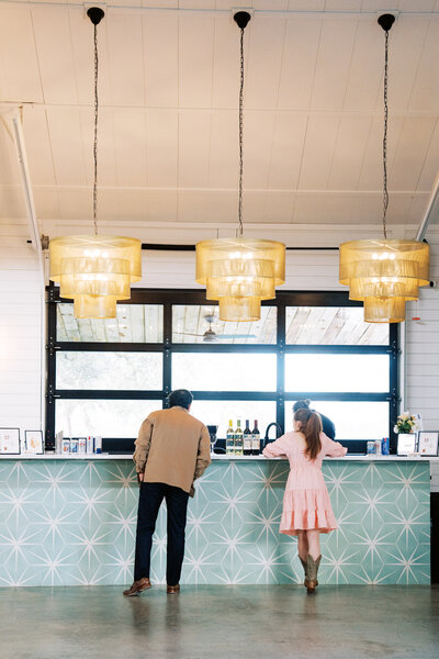 Man and woman standing at a wedding bar