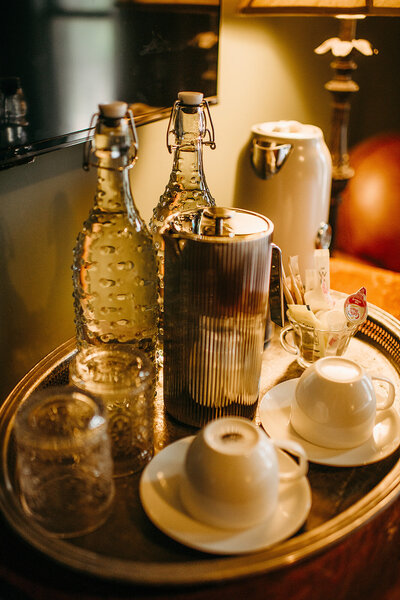 Frech Press coffee maker, cups, and glass water bottle