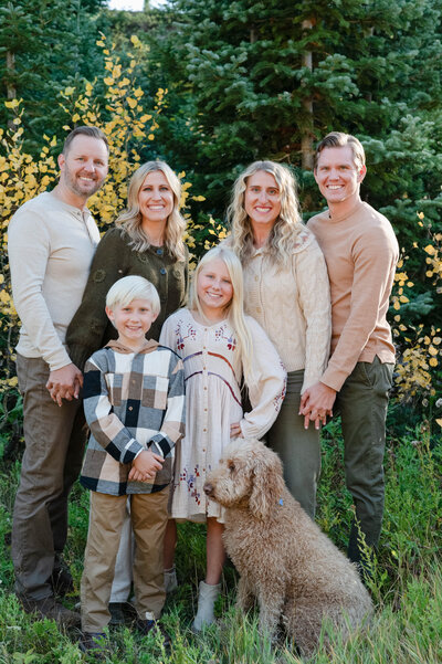 Family smiles on in the golden hour light in Cottonwood Canyon, Utah