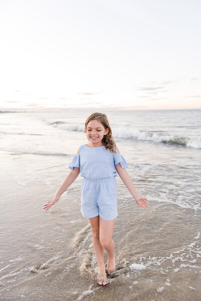 girl playing on beach by Boston Family Photographer Beth Miga Photography