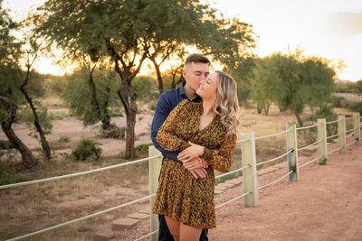 Man embraces his new fiancee after proposing to her