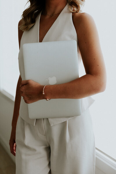 Ellie holding laptop