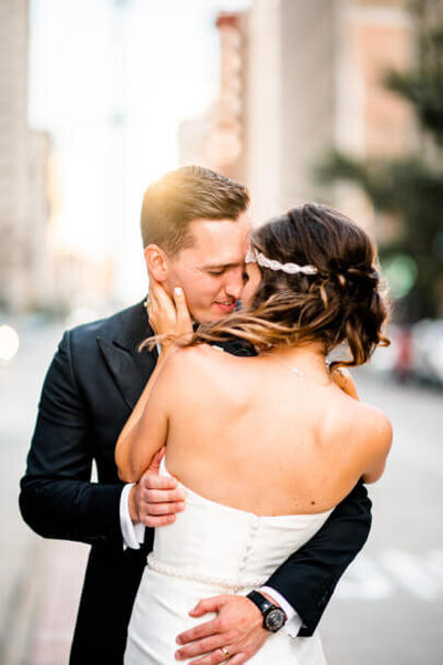 bride and groom in downtown cleveland at sunset captured by cleveland wedding photographers three and eight