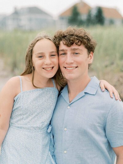 overcast family session with bother and sister in blue By Carrie Pellerin