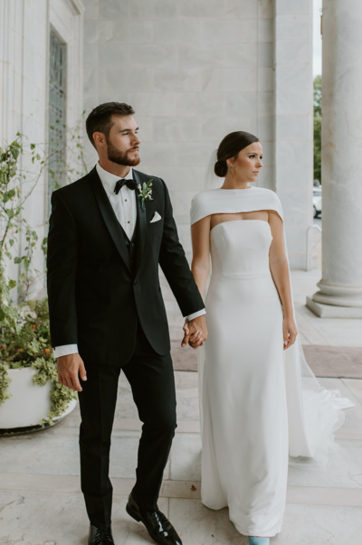 bride and groom holding eachother