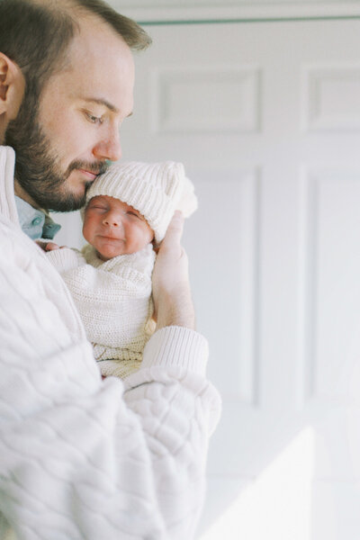 dad holding newborn baby