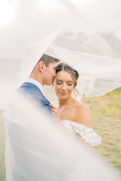 bride wipes tear from her face on wedding day