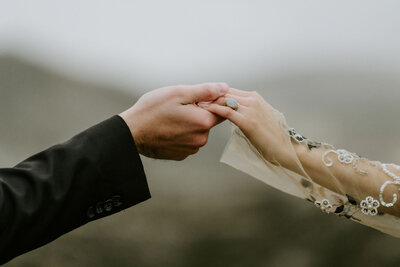 black and white image bride and groom  embracing