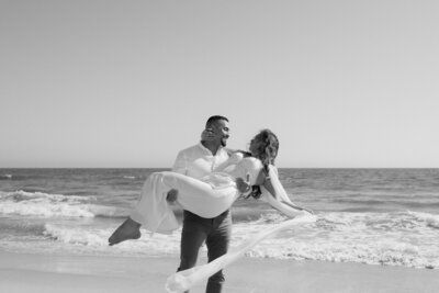 couple sitting in car during orange county elopement