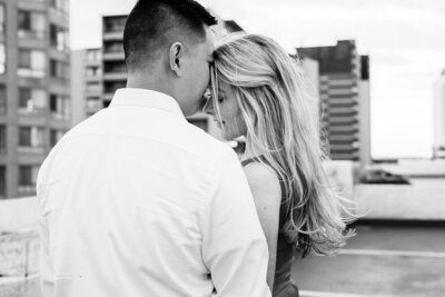 Mairead snuggles into her future husband as he rests his nose on her forehead during their engagement session in Windsor Ontario