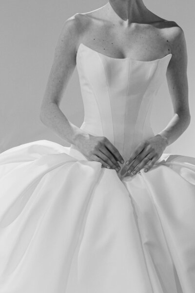 man holding onto his suit jacket