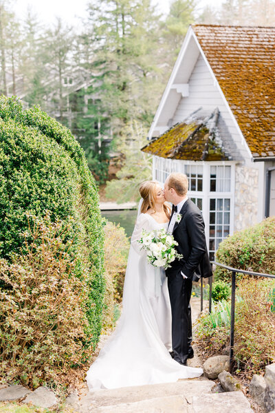 bride and groom kissing at the greystone inn
