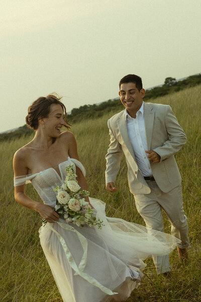 bride and groom portraits in a grassy field