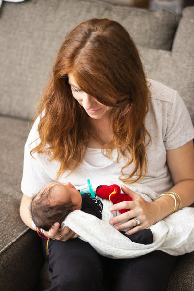 portrait of newborn held by mother with red hair by jaimee rae photography