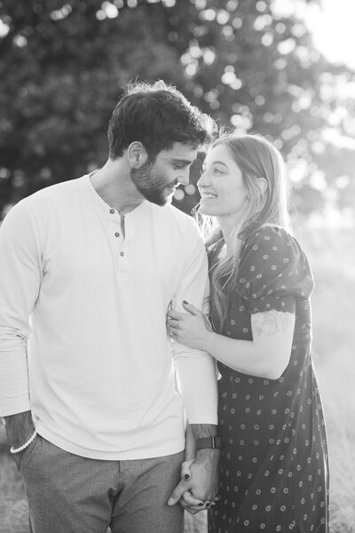 Black and white photo of couple gazing romantically at each other