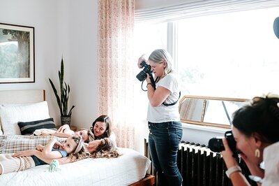 Natasha Sewell taking photos of a mom with her kids