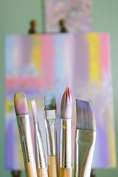 Image of brushes and a canvas