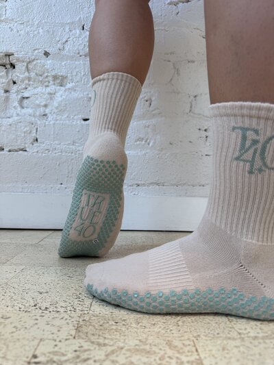 tan grippy socks with teal true40 marks