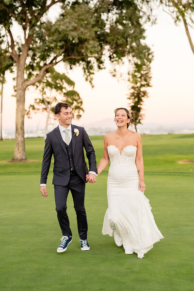 Bride and Groom kissing in vineyard at Falkner Winery