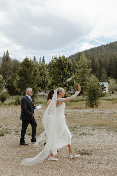 bride and groom holding each other in lake tahoe