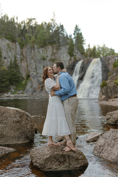 Engaged couple taking engagement photos at Tettegouche State Park along the North Shore of Minnesota