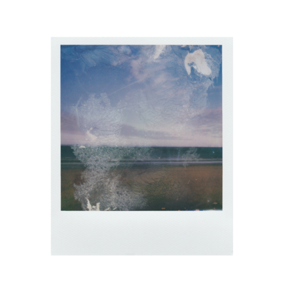 Polaroid of beach and blue sky