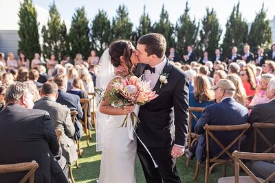 Bride and groom walk up memorial steps at their DC wedding