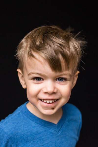 School picture of happy  toddler with blue eyes that match his shirt | Meg Sivakumar Photography in Woodinville, WA