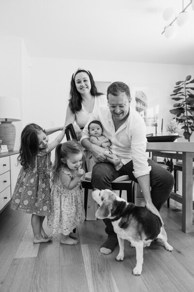 mother poses with three children