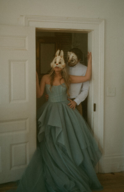 Couple with animal masks during elopement
