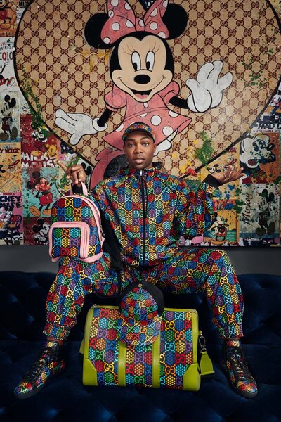 Expressive portrait of Todrick Hall in a floral Gucci suit with a thoughtful gaze, photographed by Ylva Erevall.