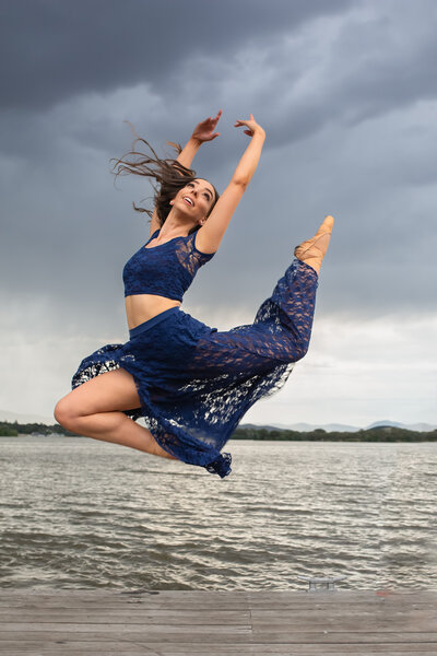 dancer jumping up at lake
