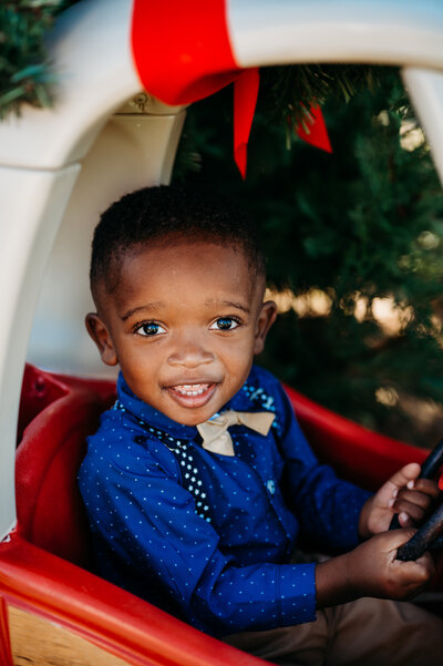 Smiling toddler during outdoor family photography session in Fort Worth captured by Poppy + Blue Photography
