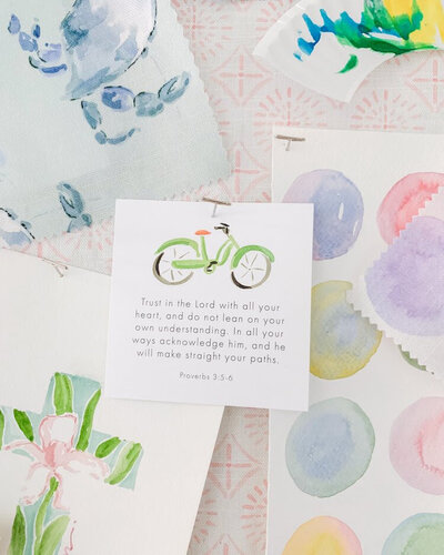 Flat lay of Camilla Moss watercolor prints