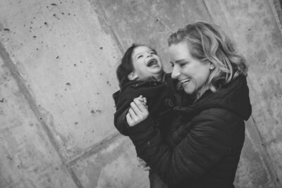 black and white image mother holding child