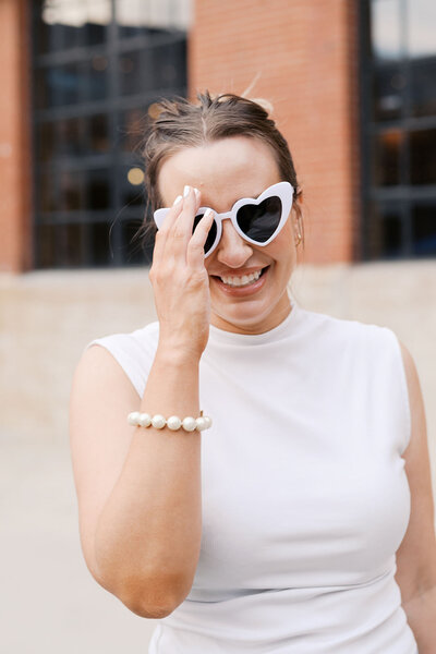 Event coordinator Alex for Raleigh event planning business wearing white sunglasses